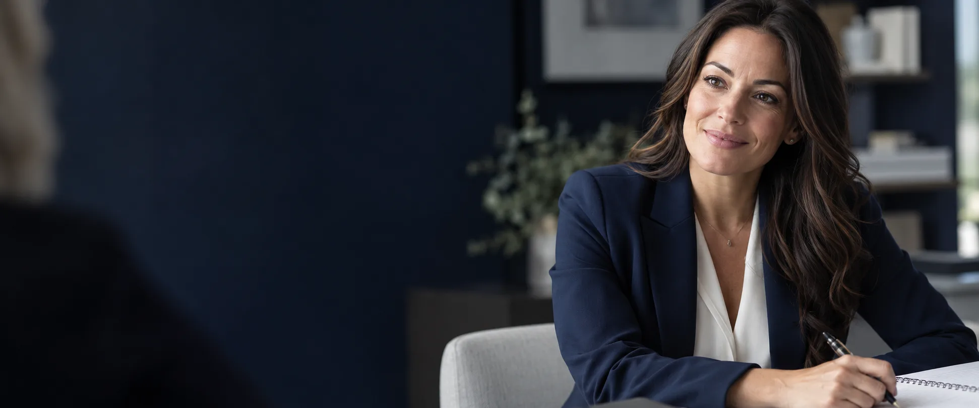 Illustrative editorial portrait of a professional listening during an admissions conversation